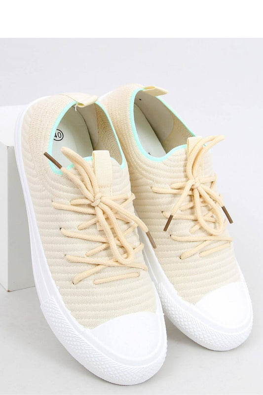 Cream sock-style sneakers with a flexible sole, perfect fit for the foot, and comfy fabric material. Ideal for versatile activities.